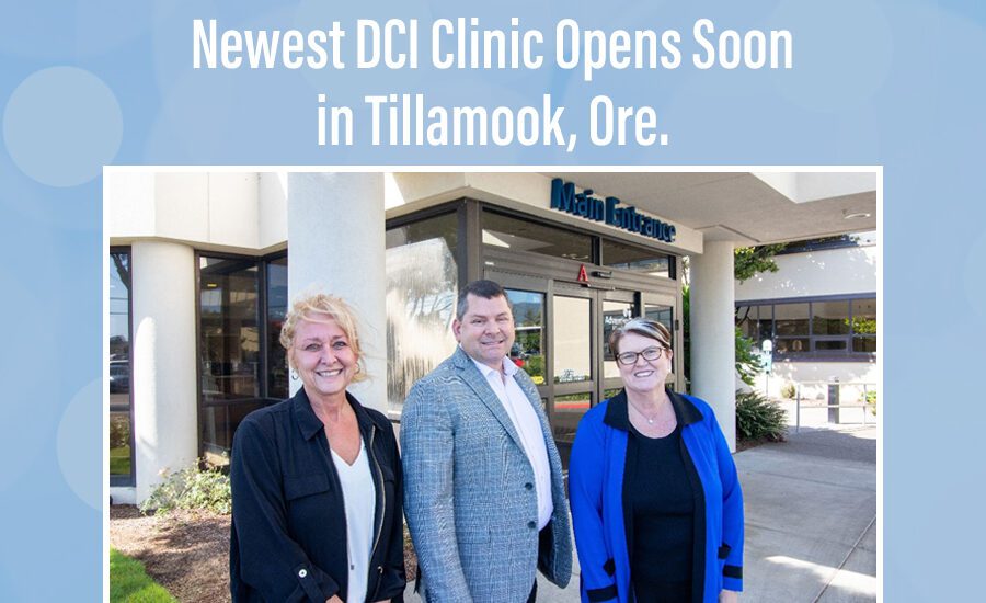 Three TKC leaders in front of clinic